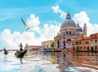 The Grand Canal of Venice in Italy with blue skies in the background